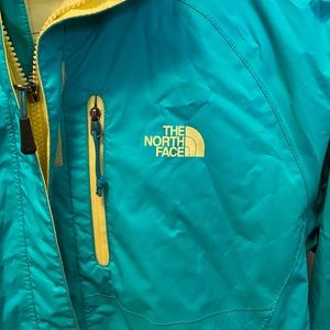 Bright blue North Face rain jacket